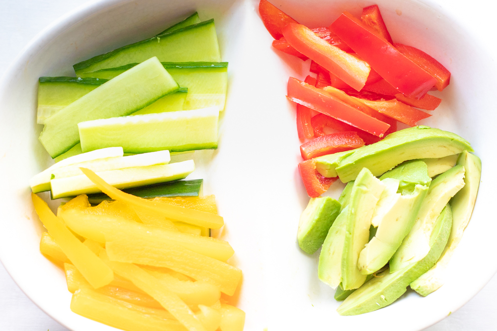 A plate with cut vegetables in thin strips