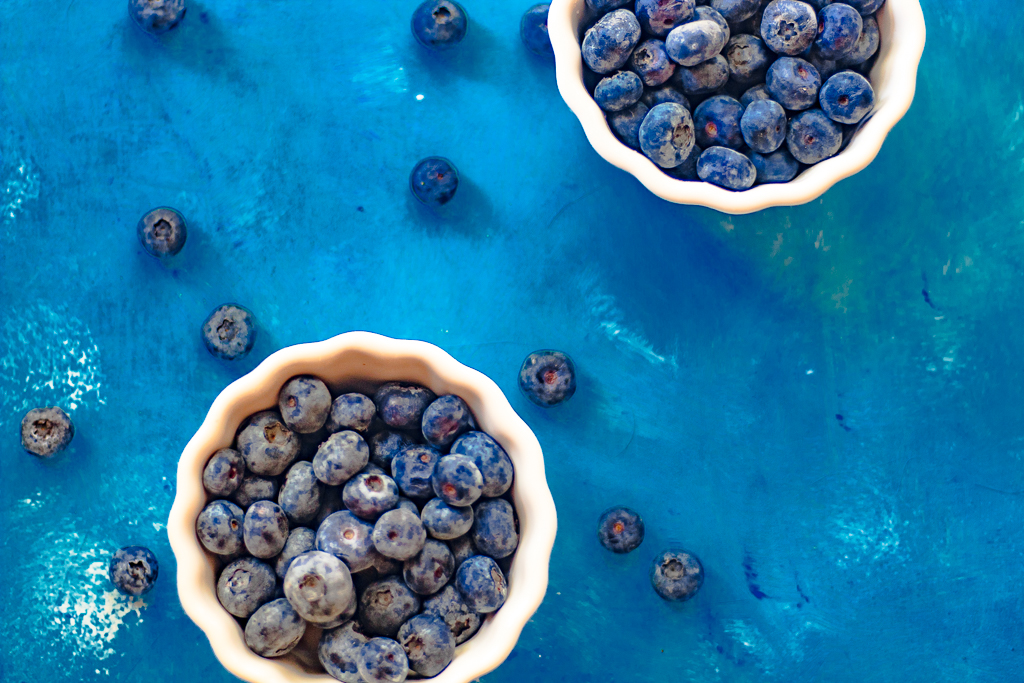 Two small bowls with blueberries