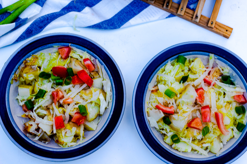 Healthy Fried Cabbage and Potatoes in two bowls