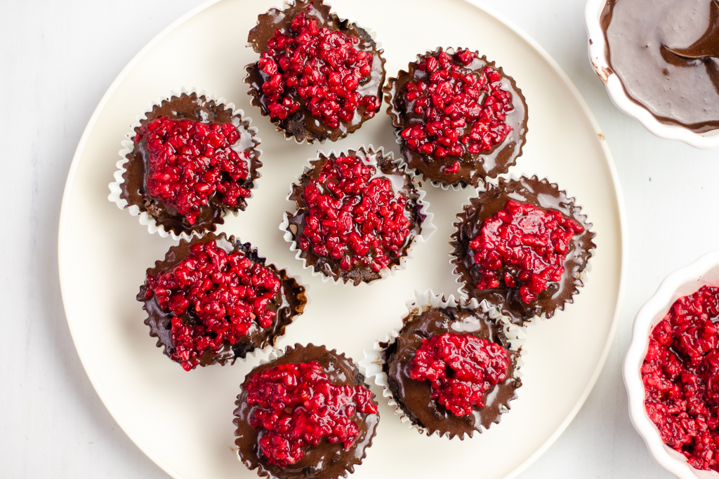 Chocolate Blueberry Paleo Cupcakes with chocolate ganache and raspberry topping