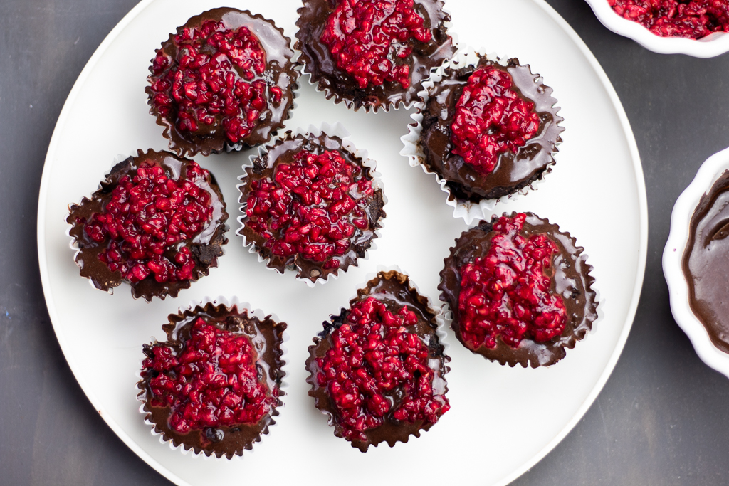 Chocolate Blueberry Paleo Cupcakes with chocolate ganache and raspberry topping